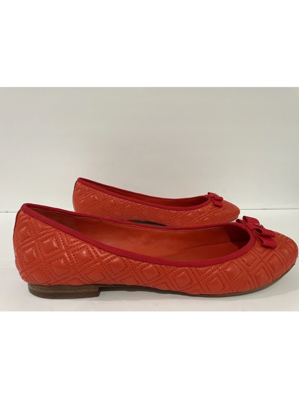 Tory Burch Quilted Orange-Red Ballet Flats with Bow Trim